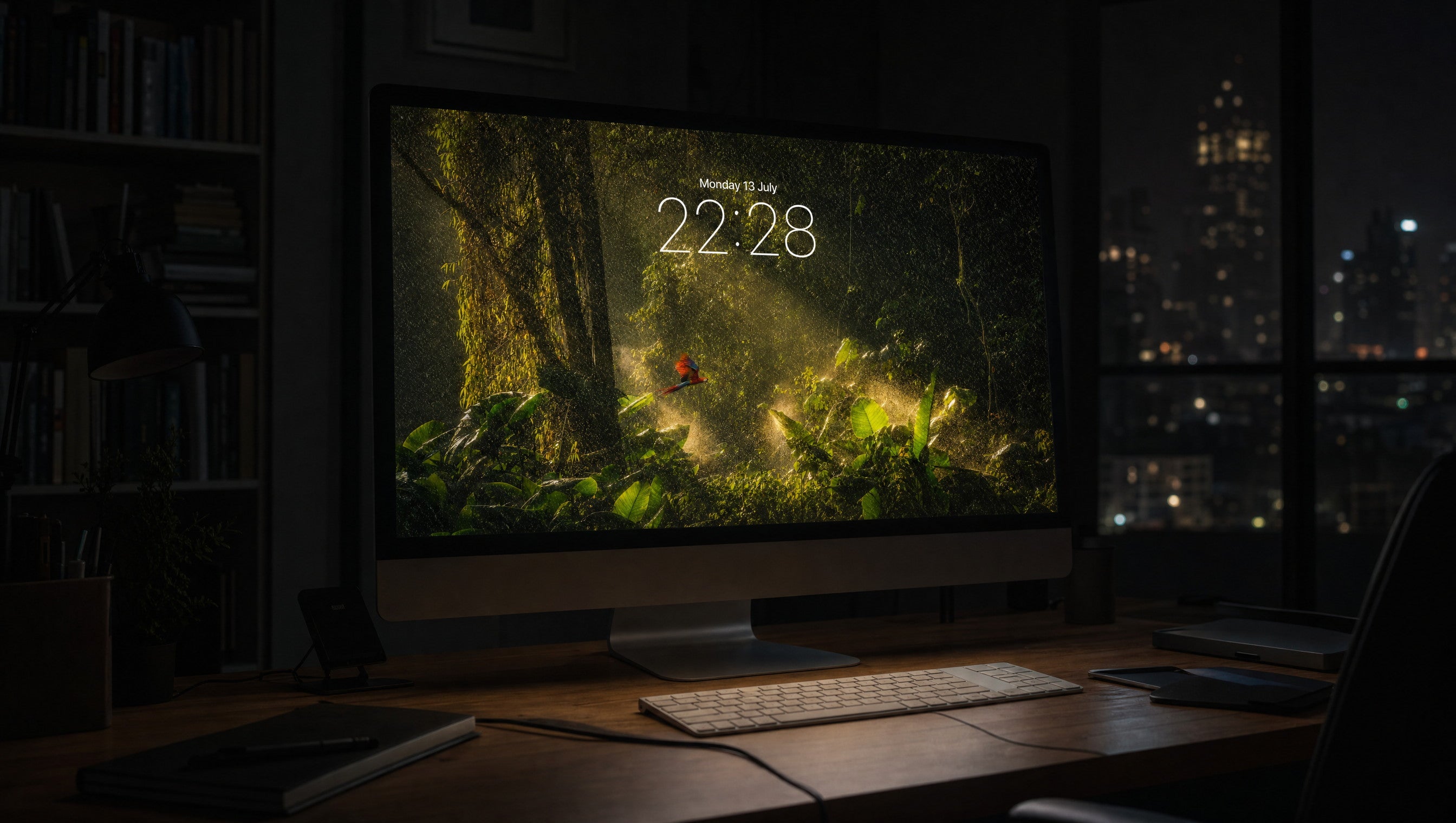 Canopy Rain wallpaper on a 27-inch display in a dark studio office at night