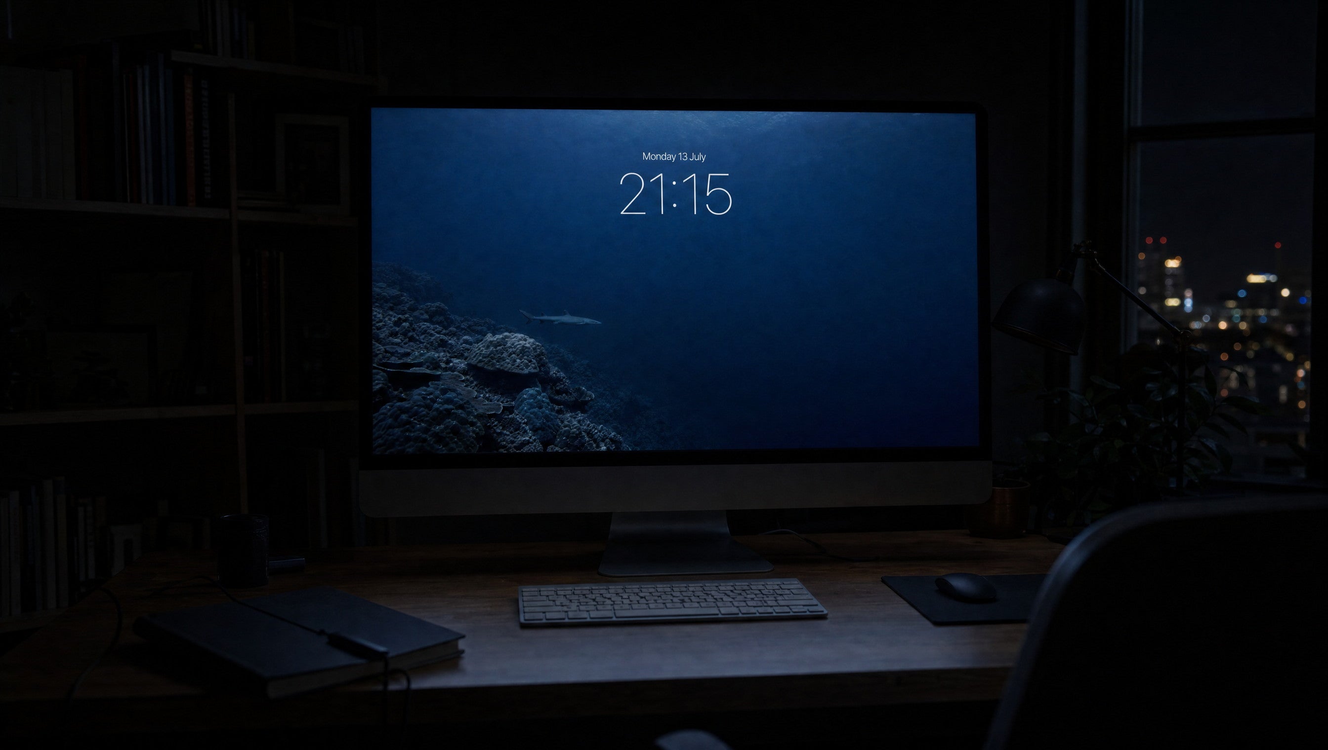 The Drop-off wallpaper on a large display in a dark studio office at night