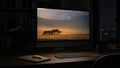 High Country wallpaper on a large display in a dark studio office at night