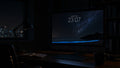 Lantern Sea wallpaper on a large display in a dark studio office at night